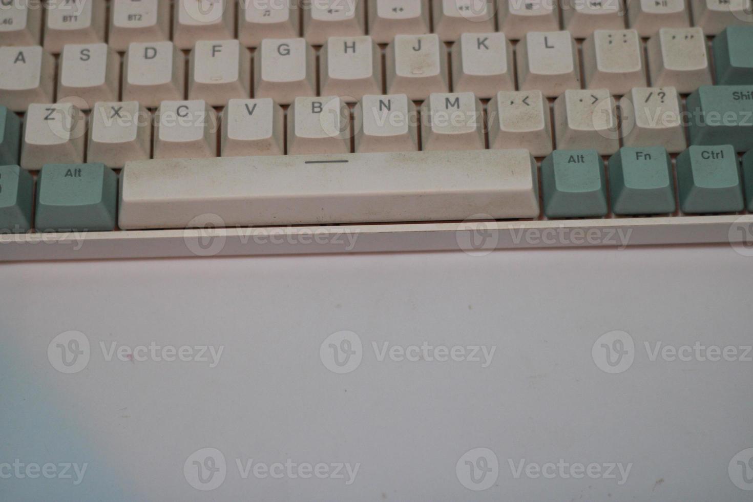 photo of a white and light blue computer keyboard