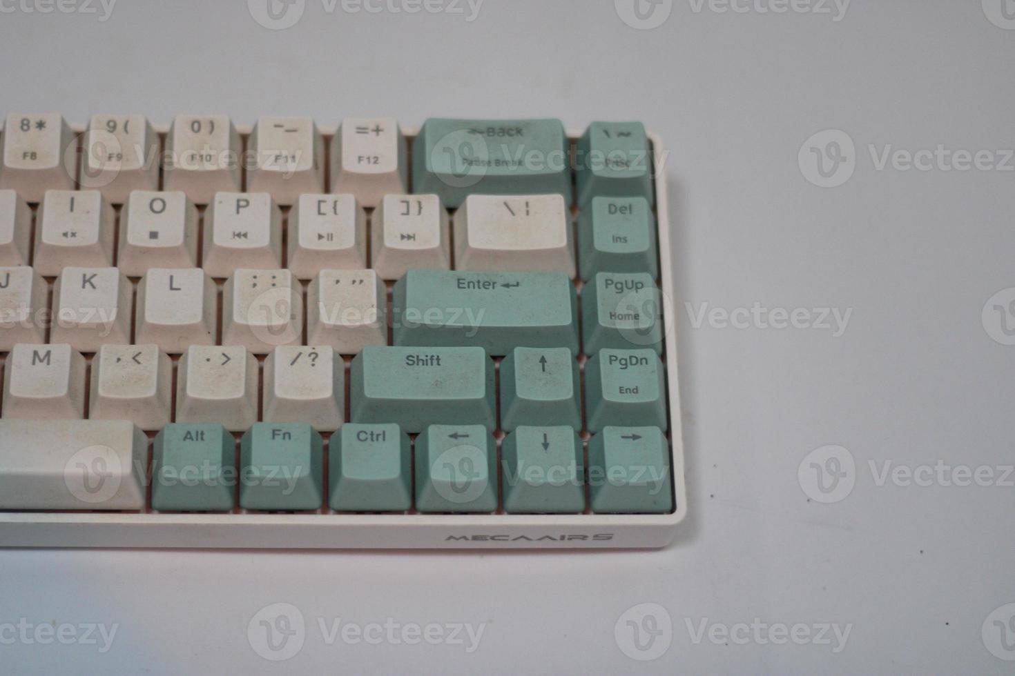 photo of a white and light blue computer keyboard
