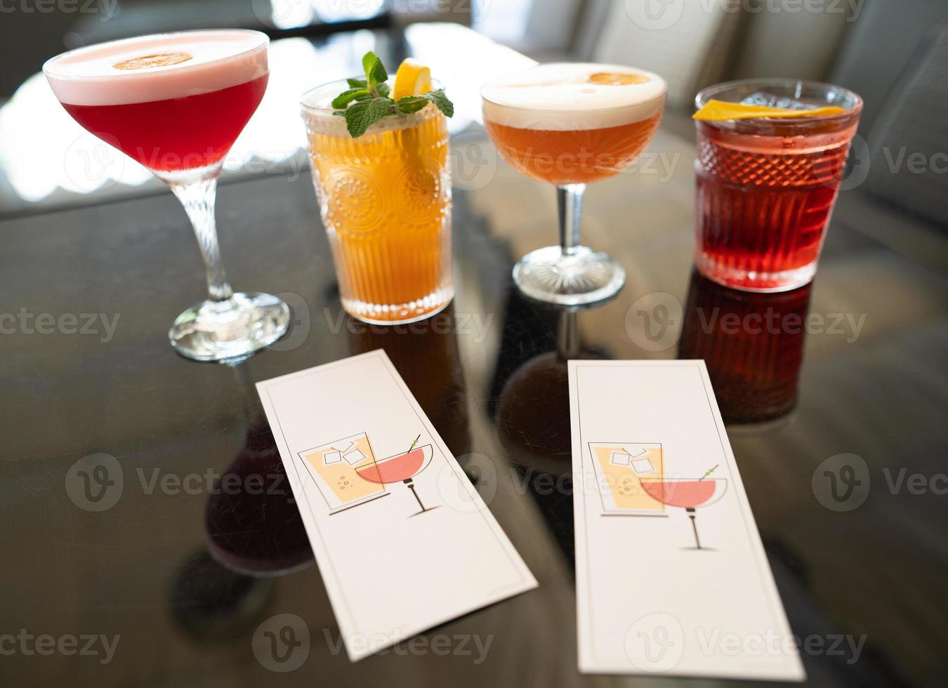 beautiful and delicious alcoholic cocktails prepared at the bar by the bartender. photo