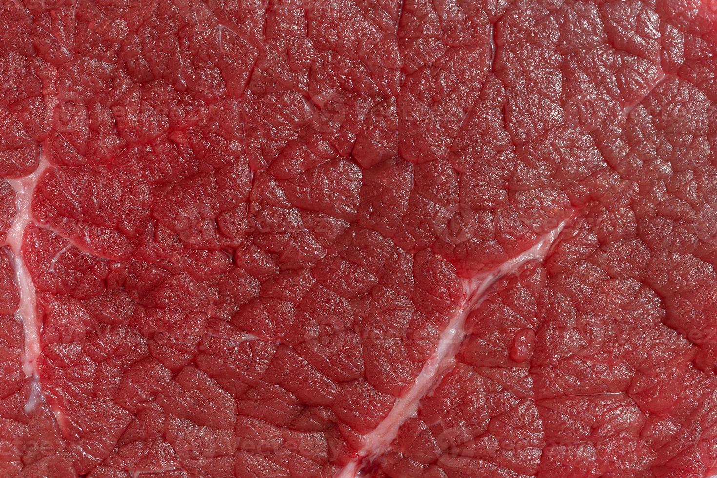 Texture of a red piece of beef, macro photo