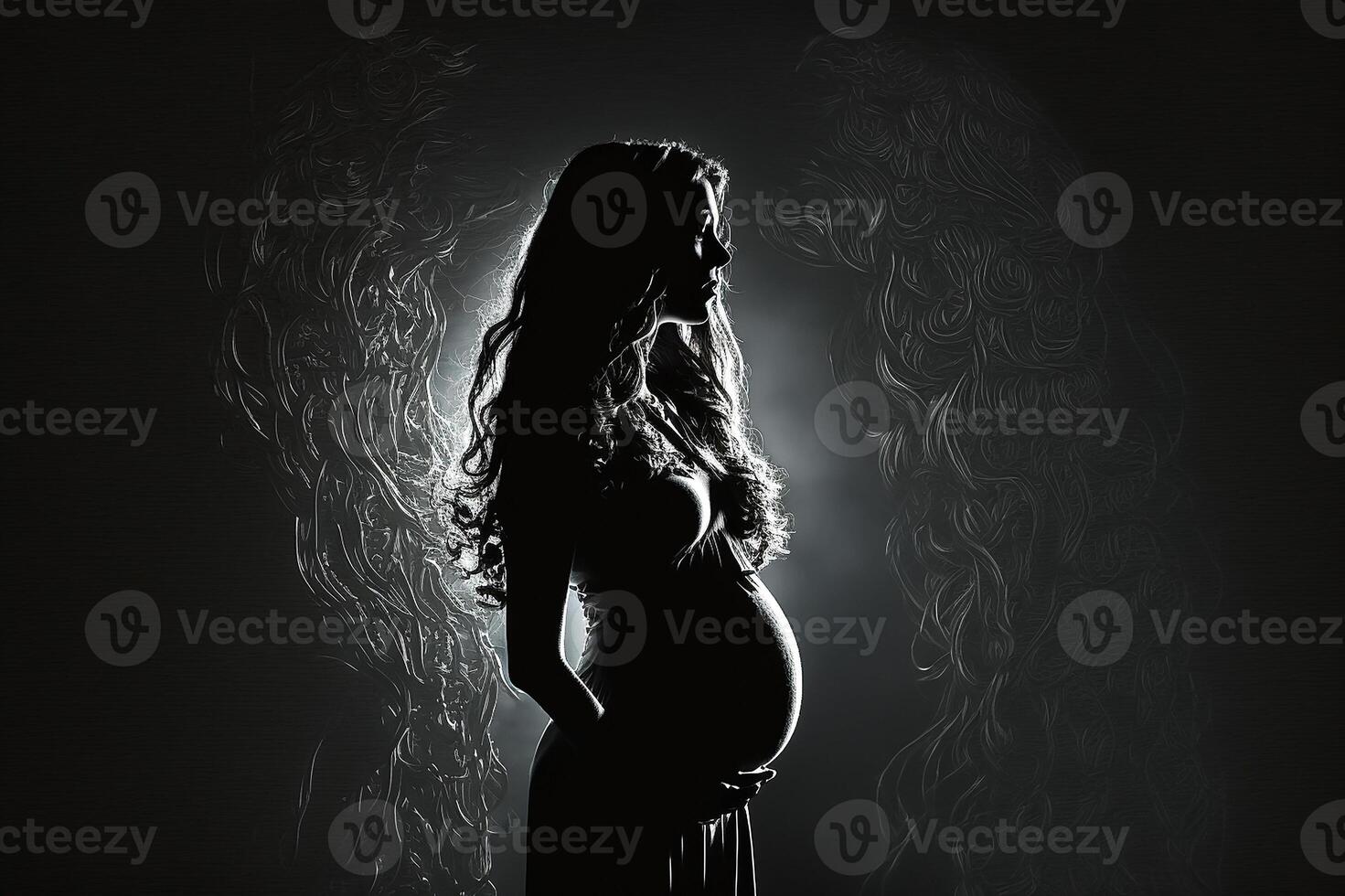 Silhouette of a pregnant woman on a dark background. photo