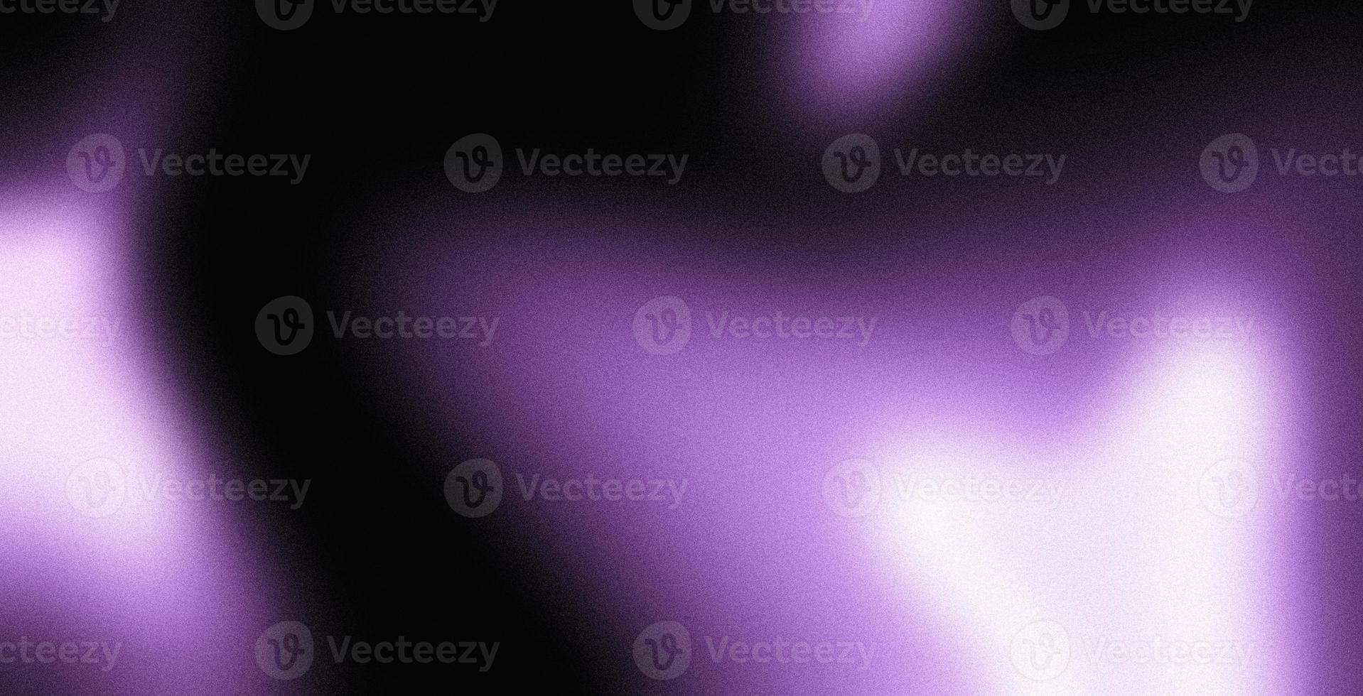 Abstract purple lights on dark grainy background, glowing light spots on black photo