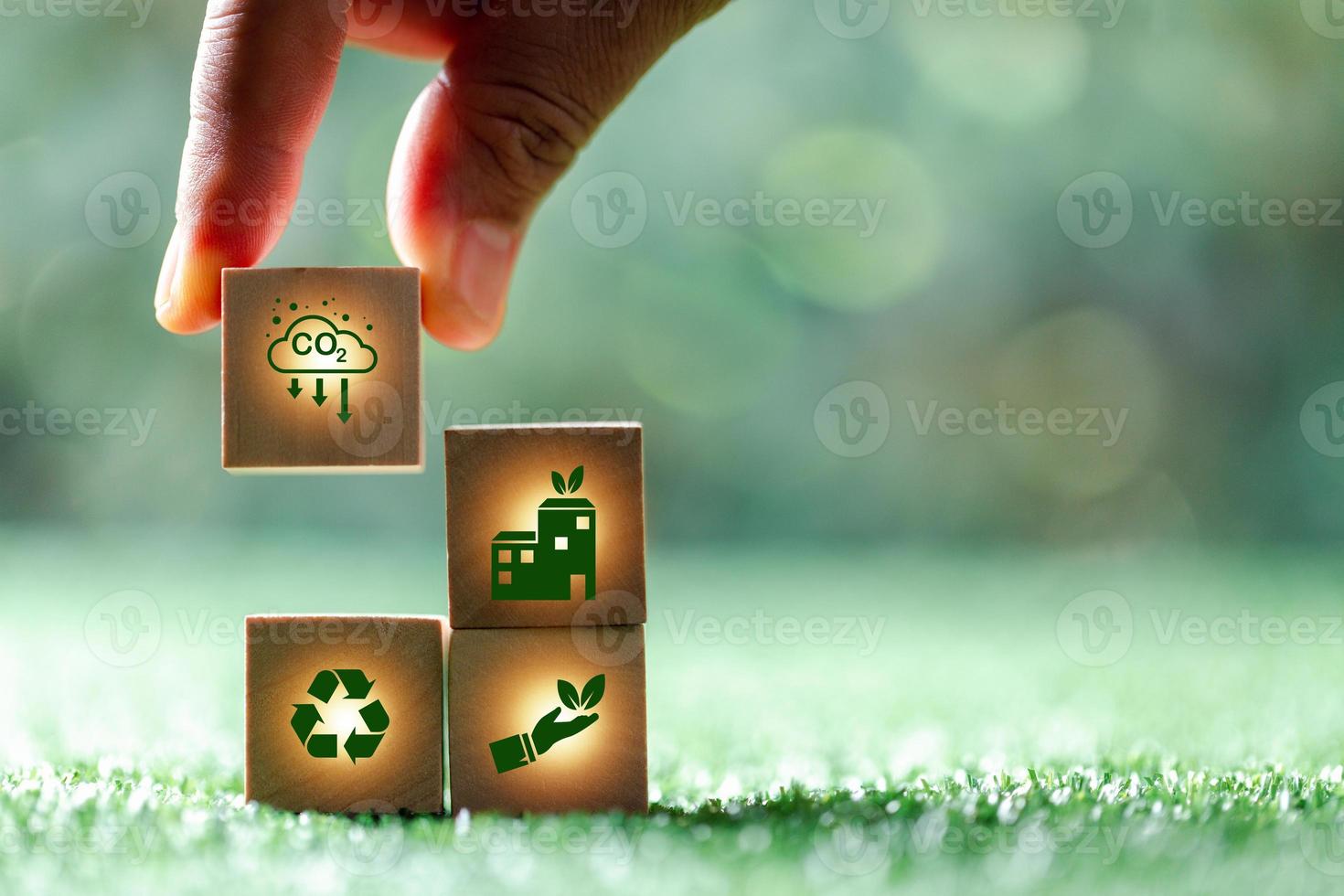 Companies are targeting net zero greenhouse gas emissions. Carbon credit concept.Tradable certificate to drive industry in direction of low emissions in efficiency cost.Wooden cubes with decrease CO2 photo
