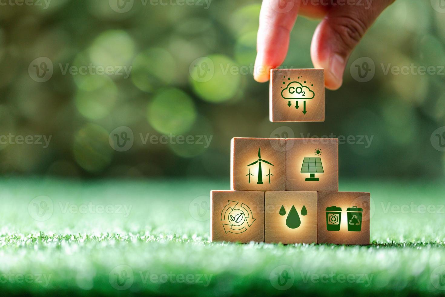 Companies are targeting net zero greenhouse gas emissions. Carbon credit concept.Tradable certificate to drive industry in direction of low emissions in efficiency cost.Wooden cubes with decrease CO2 photo
