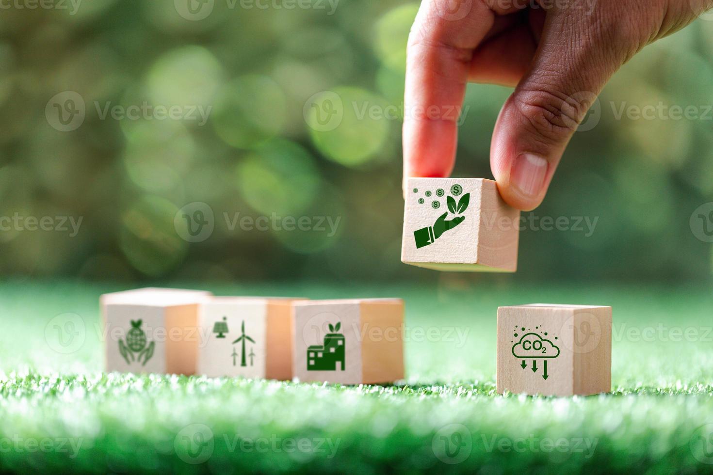 Companies are targeting net zero greenhouse gas emissions. Carbon credit concept.Tradable certificate to drive industry in direction of low emissions in efficiency cost.Wooden cubes with decrease CO2 photo