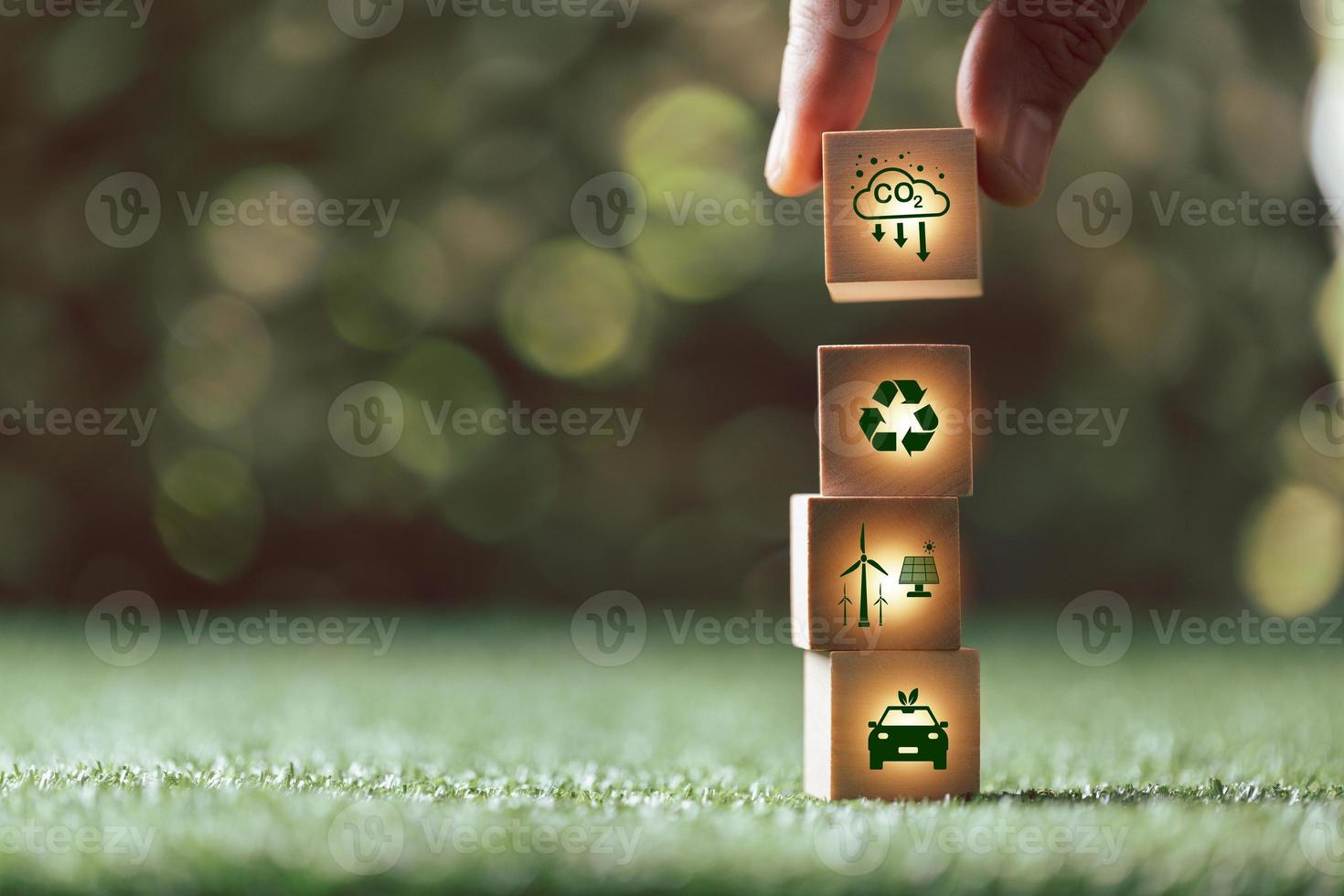 Companies are targeting net zero greenhouse gas emissions. Carbon credit concept.Tradable certificate to drive industry in direction of low emissions in efficiency cost.Wooden cubes with decrease CO2 photo