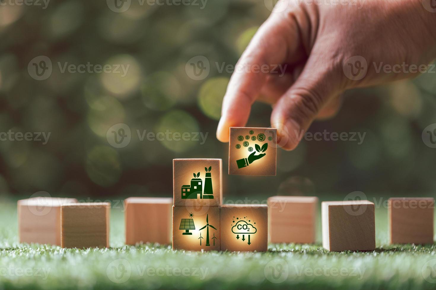 Companies are targeting net zero greenhouse gas emissions. Carbon credit concept.Tradable certificate to drive industry in direction of low emissions in efficiency cost.Wooden cubes with decrease CO2 photo