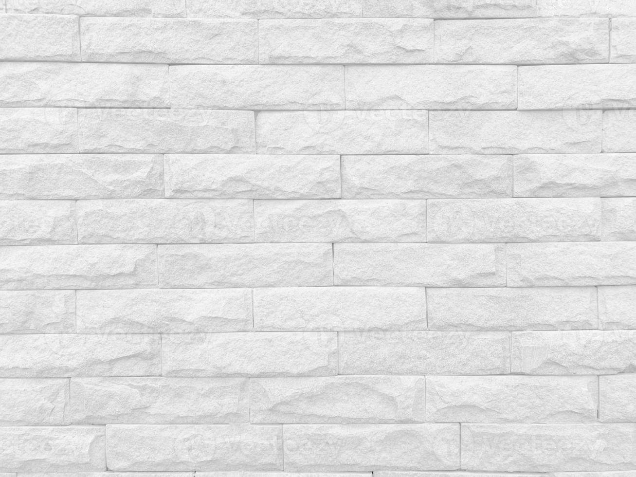 Seamless texture of white stone wall a rough surface, with space for text, for a background. photo