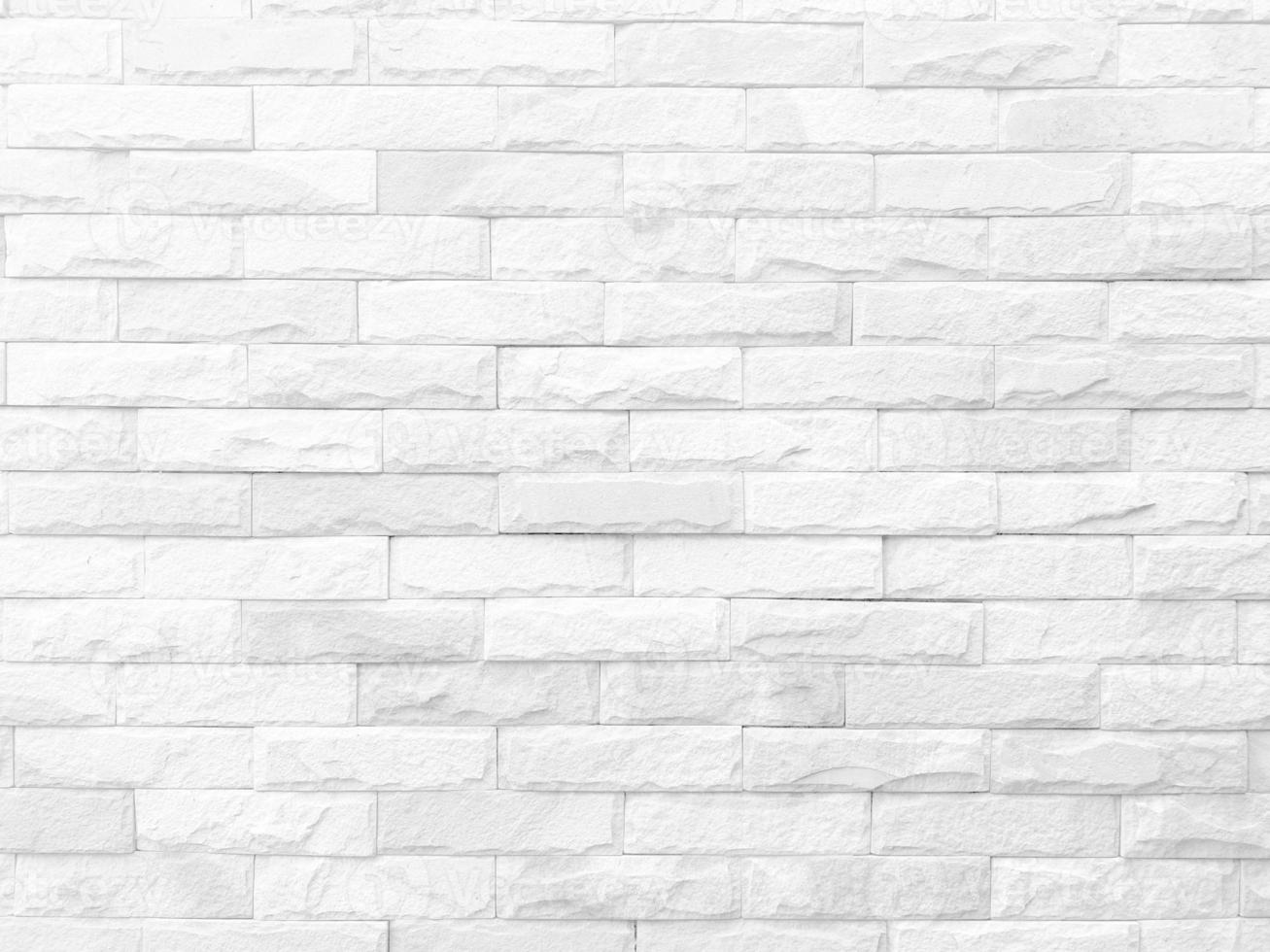 Seamless texture of white stone wall a rough surface, with space for text, for a background. photo