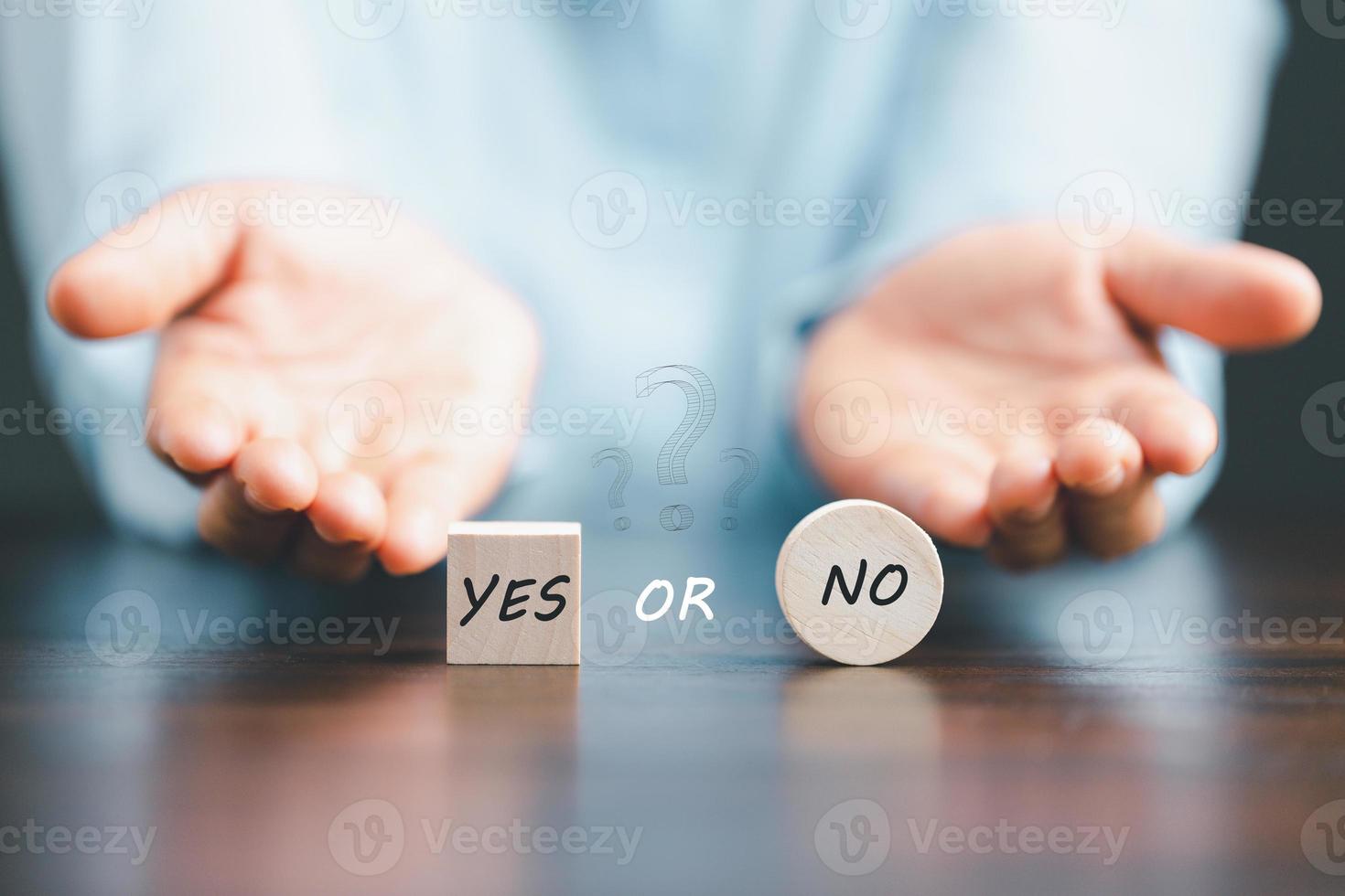 Concept of choice yes on wooden cubic blocks. Think with Yes or No choice, Business choices for difficult situations, Business woman hands with wooden with yes word on it. photo