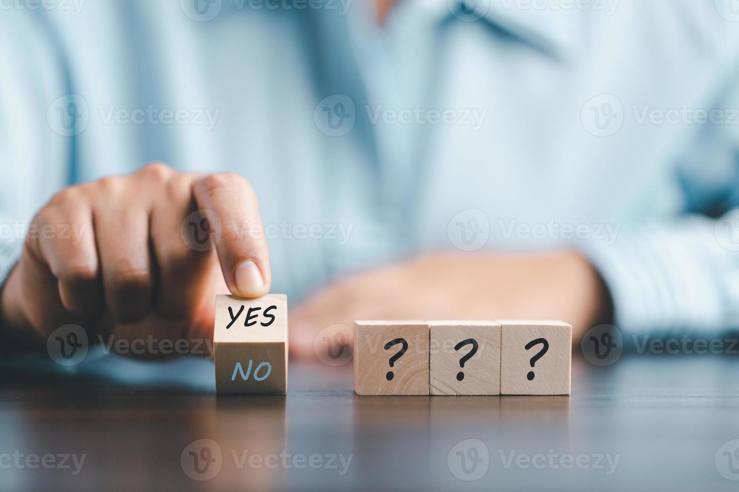 Concept of choice yes on wooden cubic blocks. Think with Yes or No choice, Business choices for difficult situations, Business woman hands with wooden with yes word on it. photo