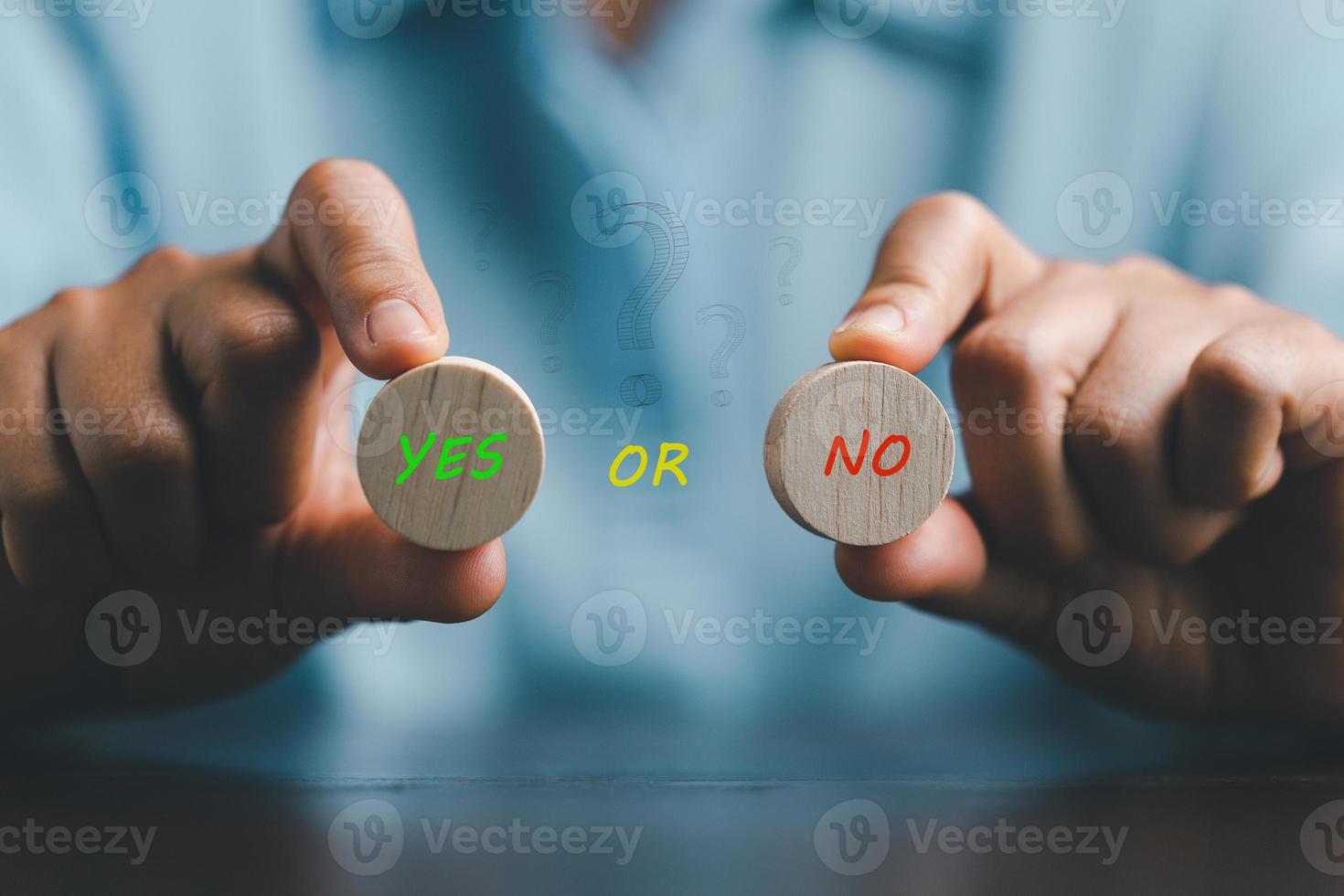 Concept of choice yes or no on wooden cubic blocks. Think with Yes or No choice, Business choices for difficult situations, Business woman hands holding two wooden with yes or no word on it. photo