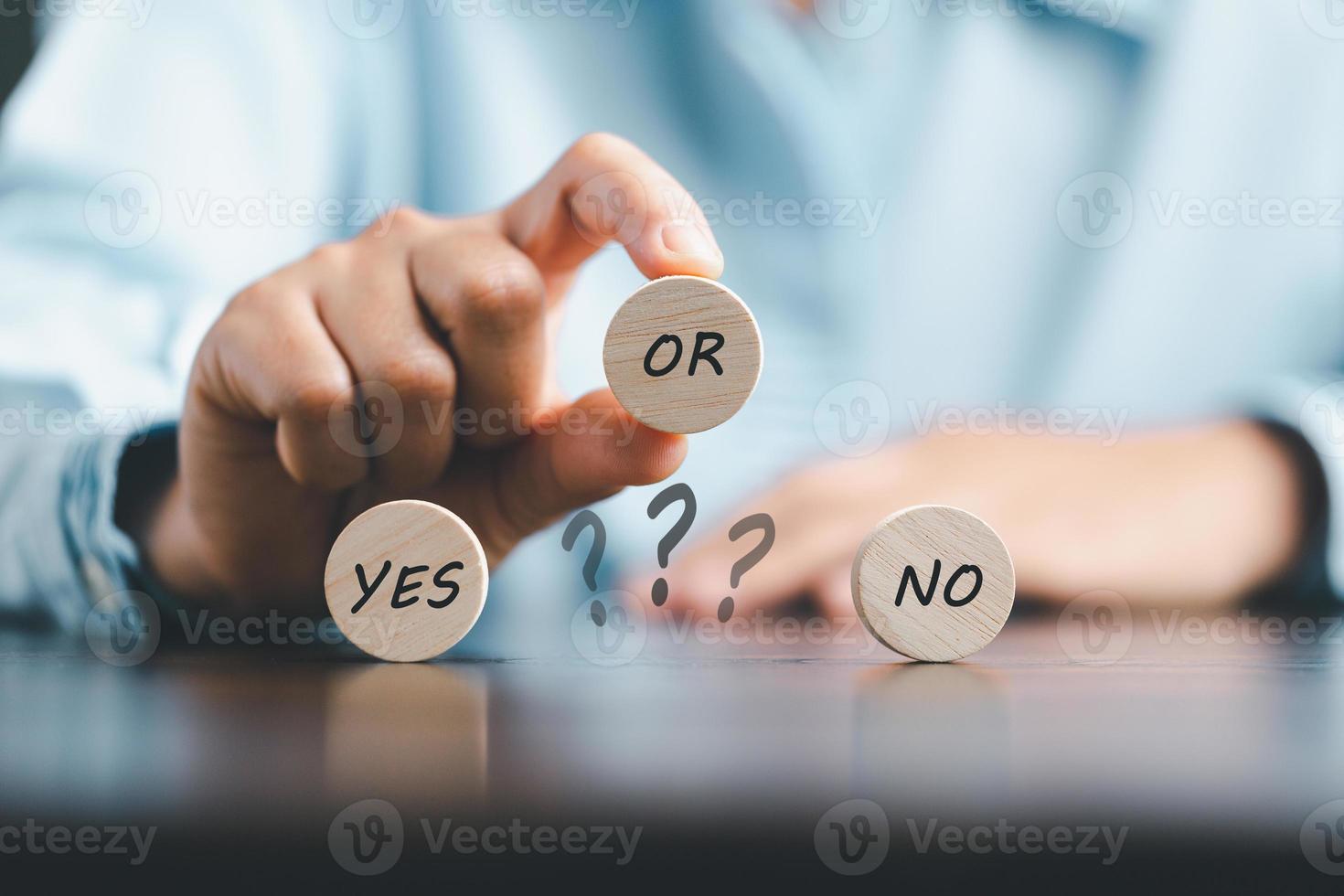 Concept of choice yes on wooden cubic blocks. Think with Yes or No choice, Business choices for difficult situations, Business woman hands with wooden with yes word on it. photo