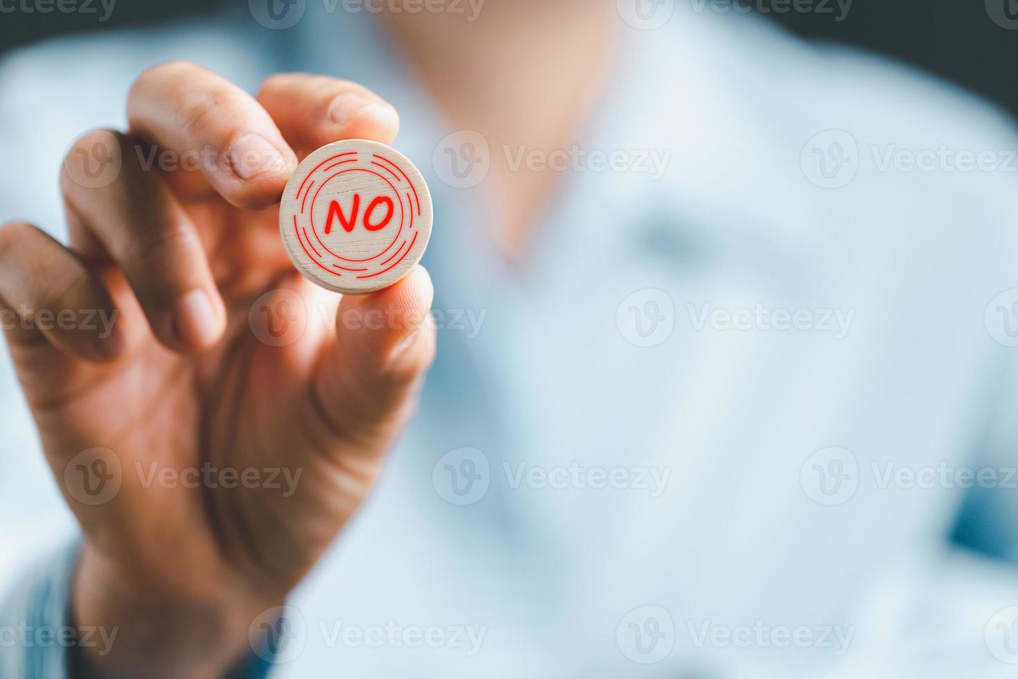 Concept of choice no on wooden cubic blocks. Think with Yes or No choice, Business choices for difficult situations, Business woman hands holding wooden with no word on it. photo