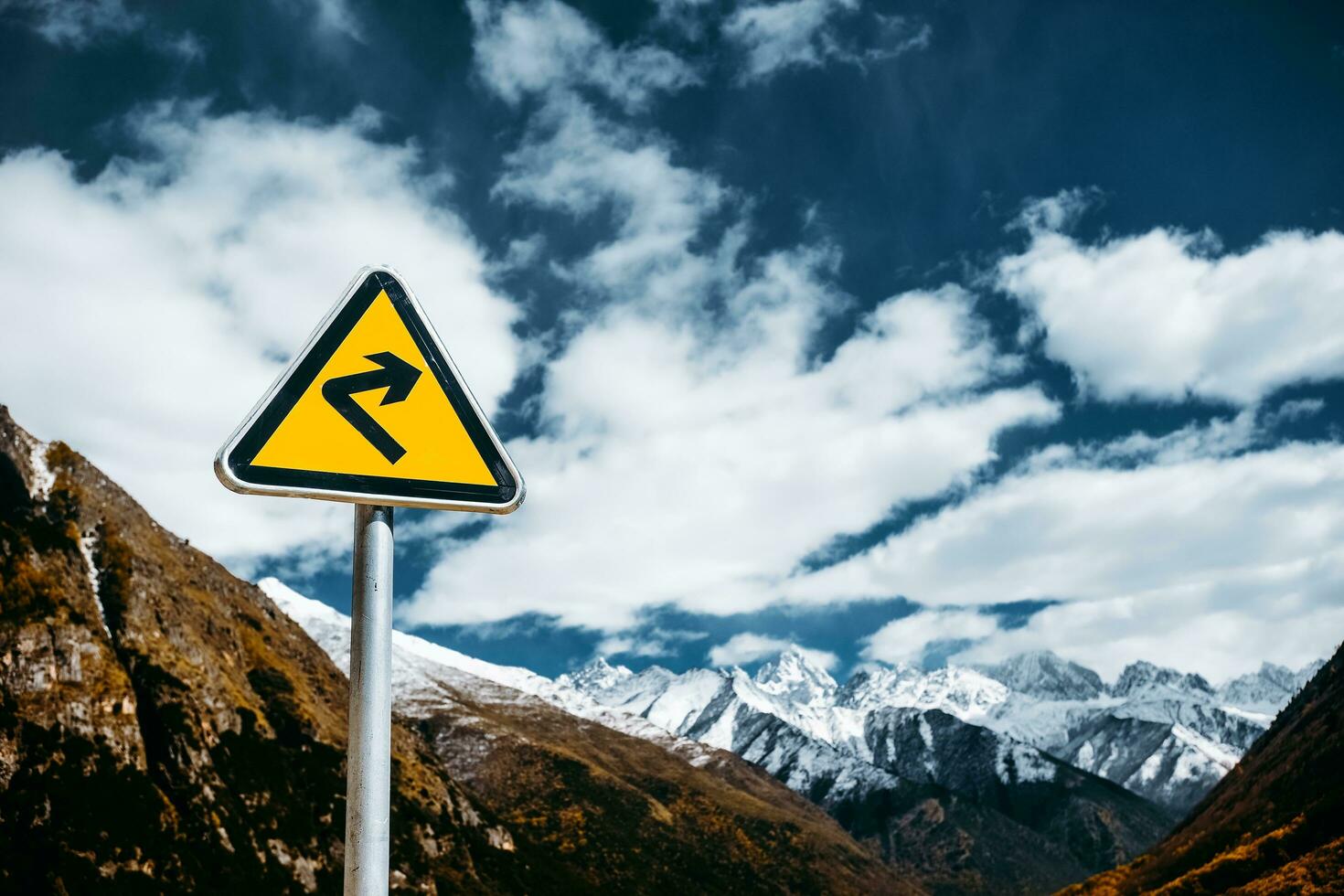 Traffic sign on the high mountain road photo