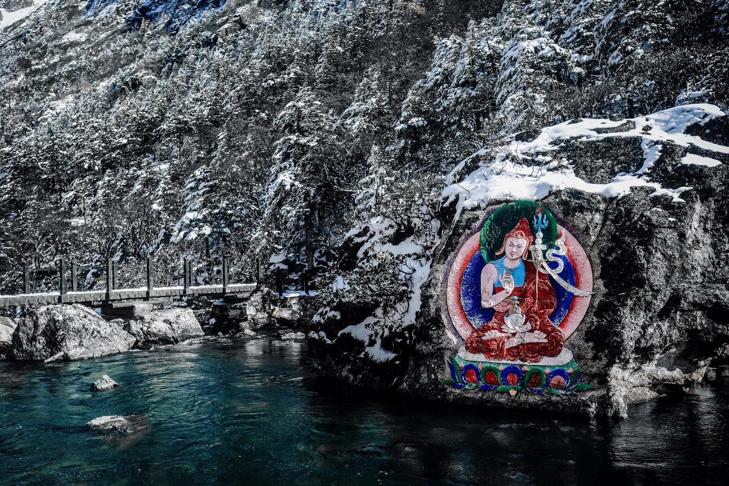 Stone carvings and paintings of Tibetan Buddha statues in the mountains of western Sichuan, China photo