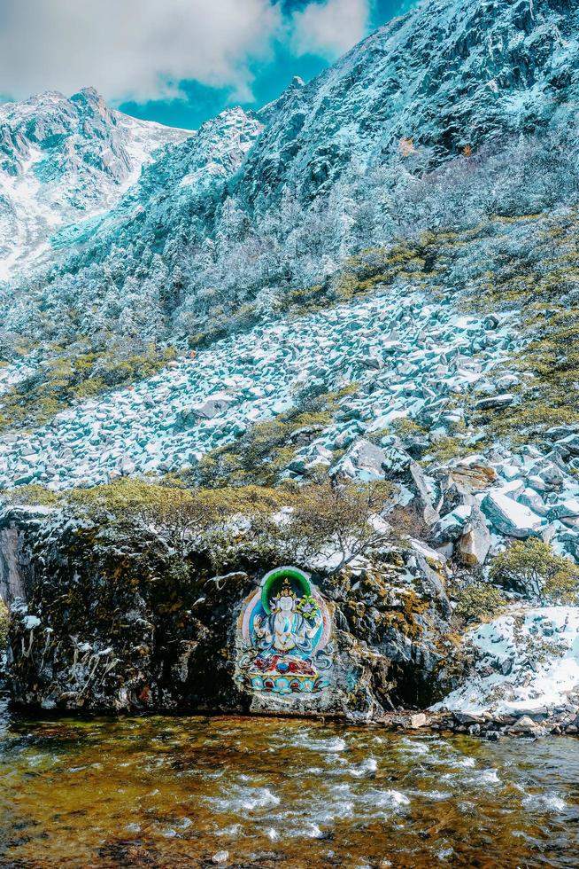 Stone carvings and paintings of Tibetan Buddha statues in the mountains of western Sichuan, China photo