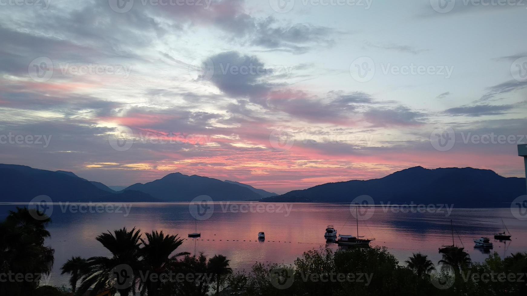 beautiful seascape with sea palm trees and mountains, summer background, vacation background, copy space photo