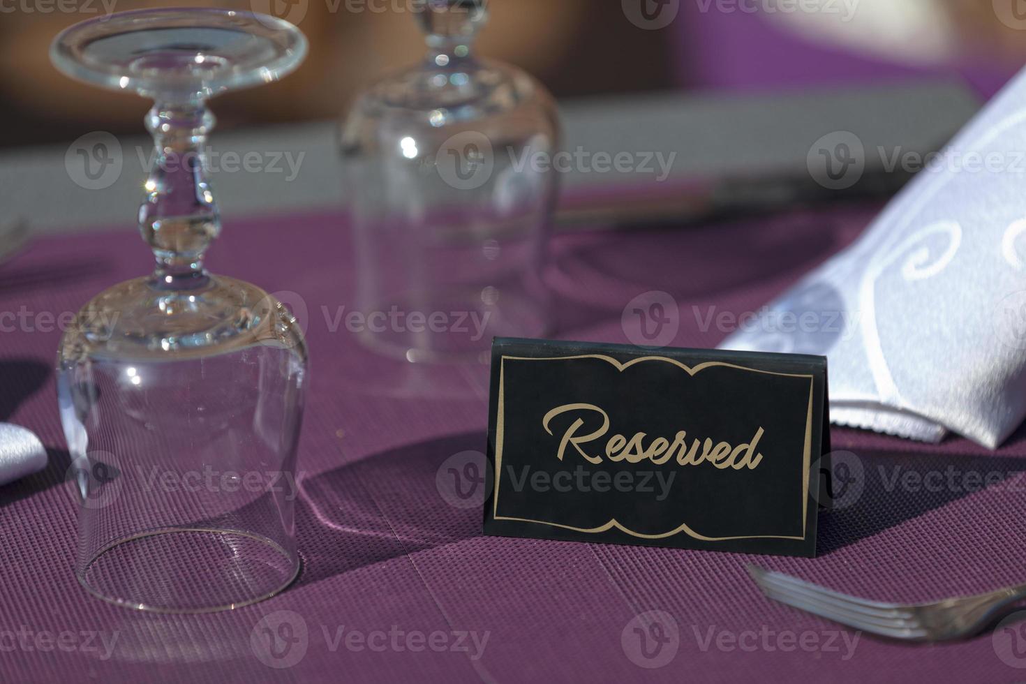 Reserved sign on a table photo