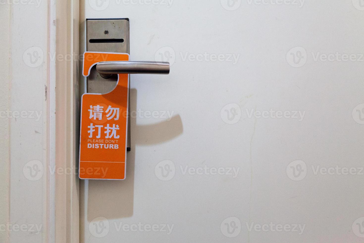 Please don't disturb sign in 2 languages photo