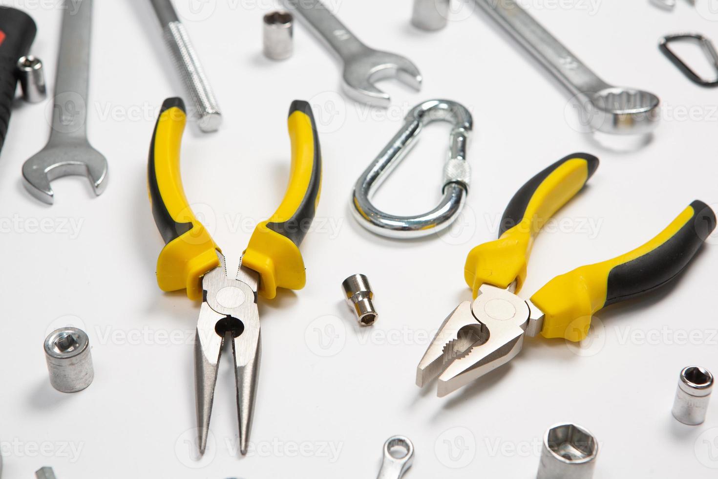 Set of tools for repair in a case on a white background. Assorted work or construction tools. Wrenches, Pliers, screwdriver. Top view photo