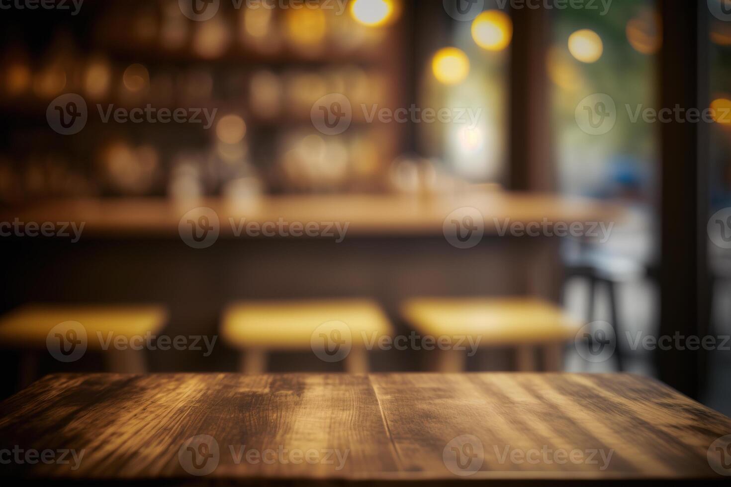 Wooden table in front of abstract blurred coffee shop background. photo