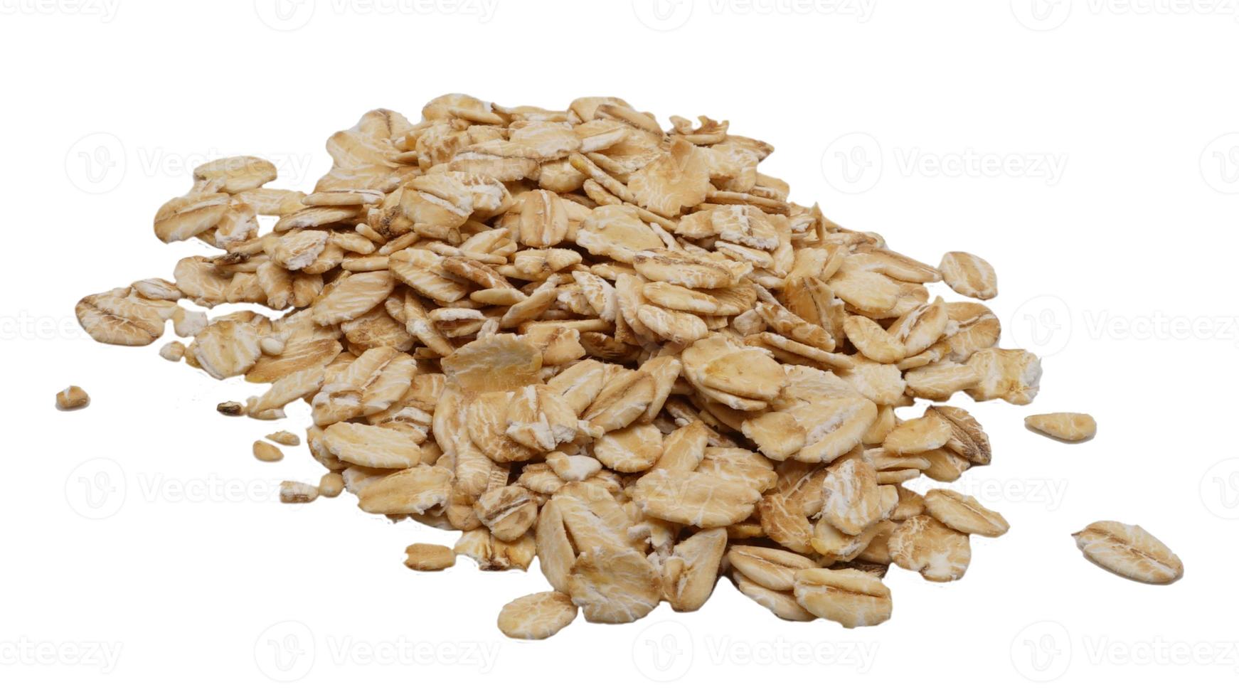 Oat flakes. Pile of oat flakes isolated on white background. photo