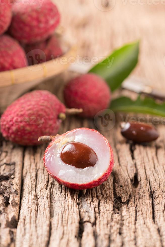 fresh organic lychee fruit on wood photo