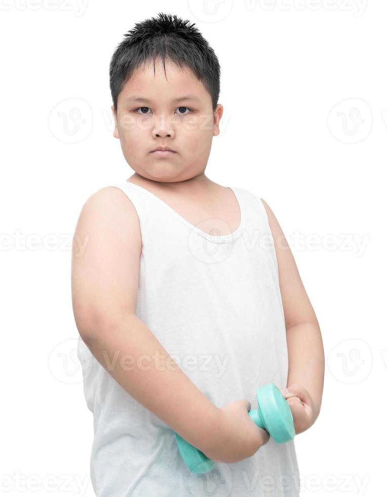 handsome obese boy is doing exercises with dumbbells photo