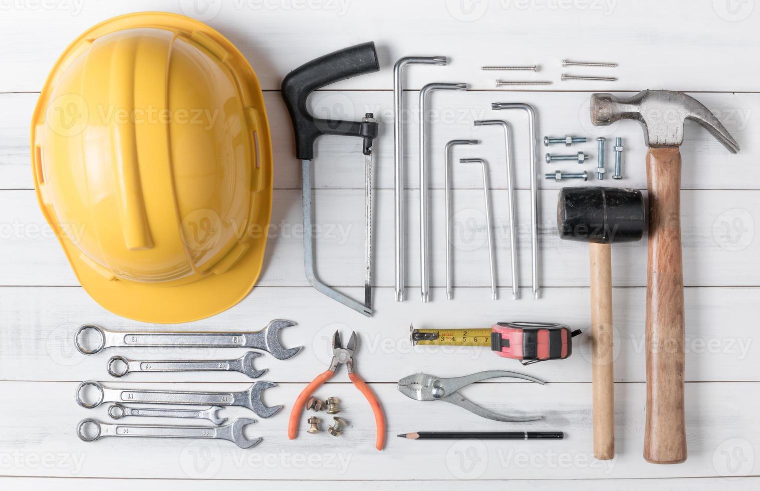 set of tools supplies on wood background photo