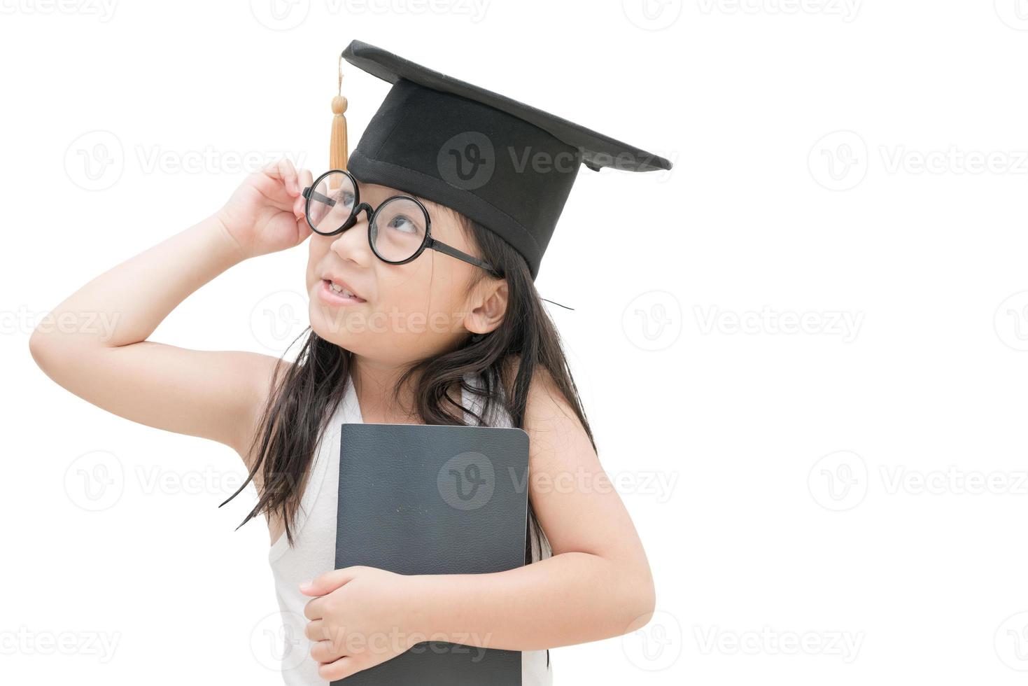 school kid graduate thinking with graduation cap isolated photo