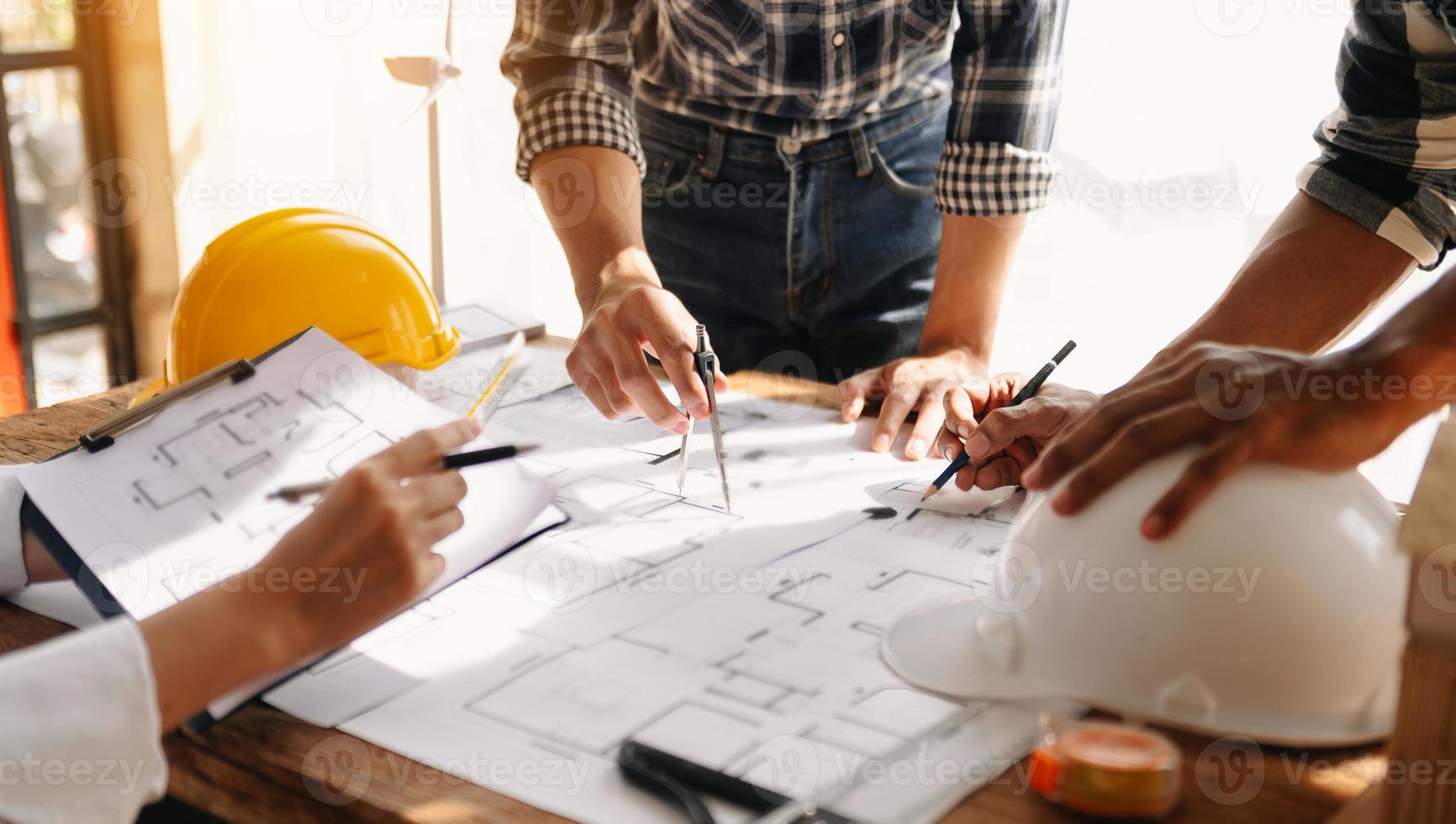 Confident team of architect working together in a office.Then discussing about new startup project on desk.in office photo