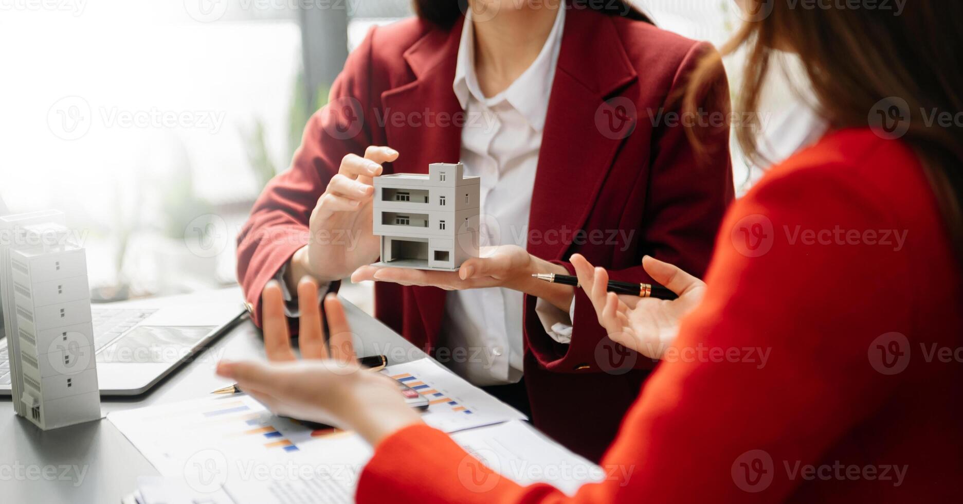Signing a contract. Client and broker agent, lease agreement, successful deal and  Young business sitting at the desk photo