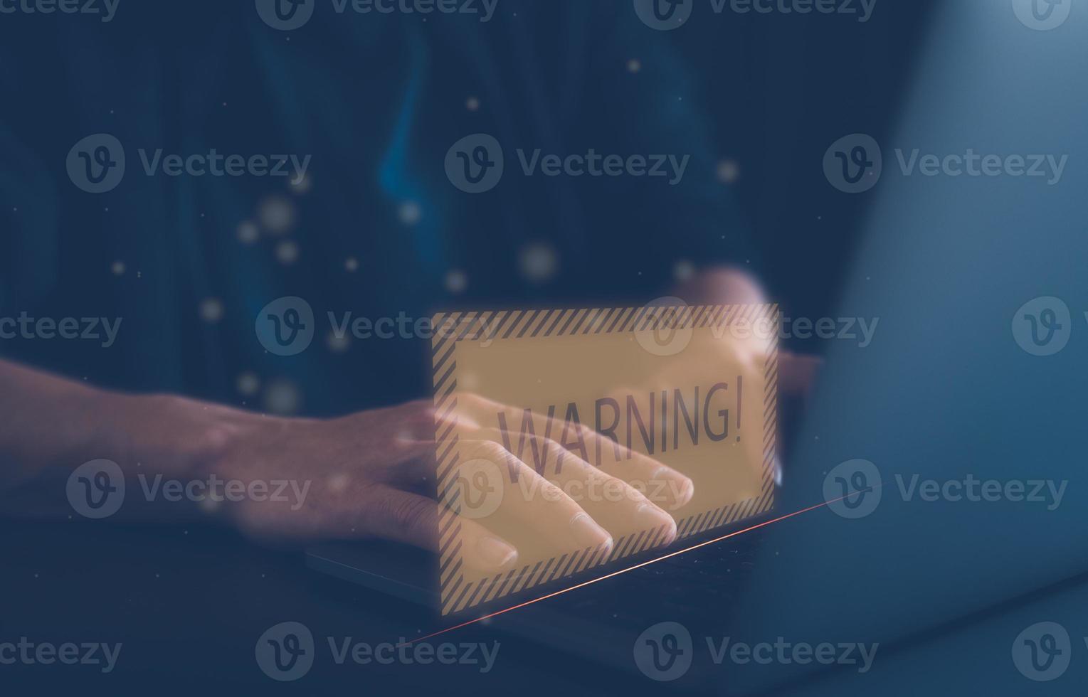 internet network security concept, man working on computer  with  warning sign developer with triangle caution warning sign for notification error and maintenance, e-document data protection photo