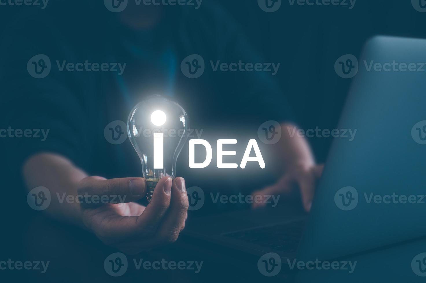 idea creativity concept, man holding light bulb with word idea, inspiration and innovation new technology photo