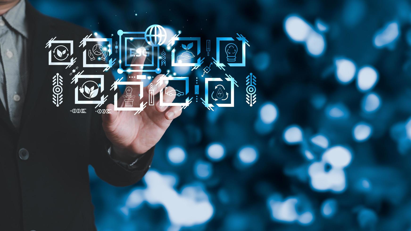 hand touch hologram to save energy,and reduce world warming,climate change,ecology friendly investment,ESG environment social governance,Green Business Innovation and Sustainable Development concept. photo