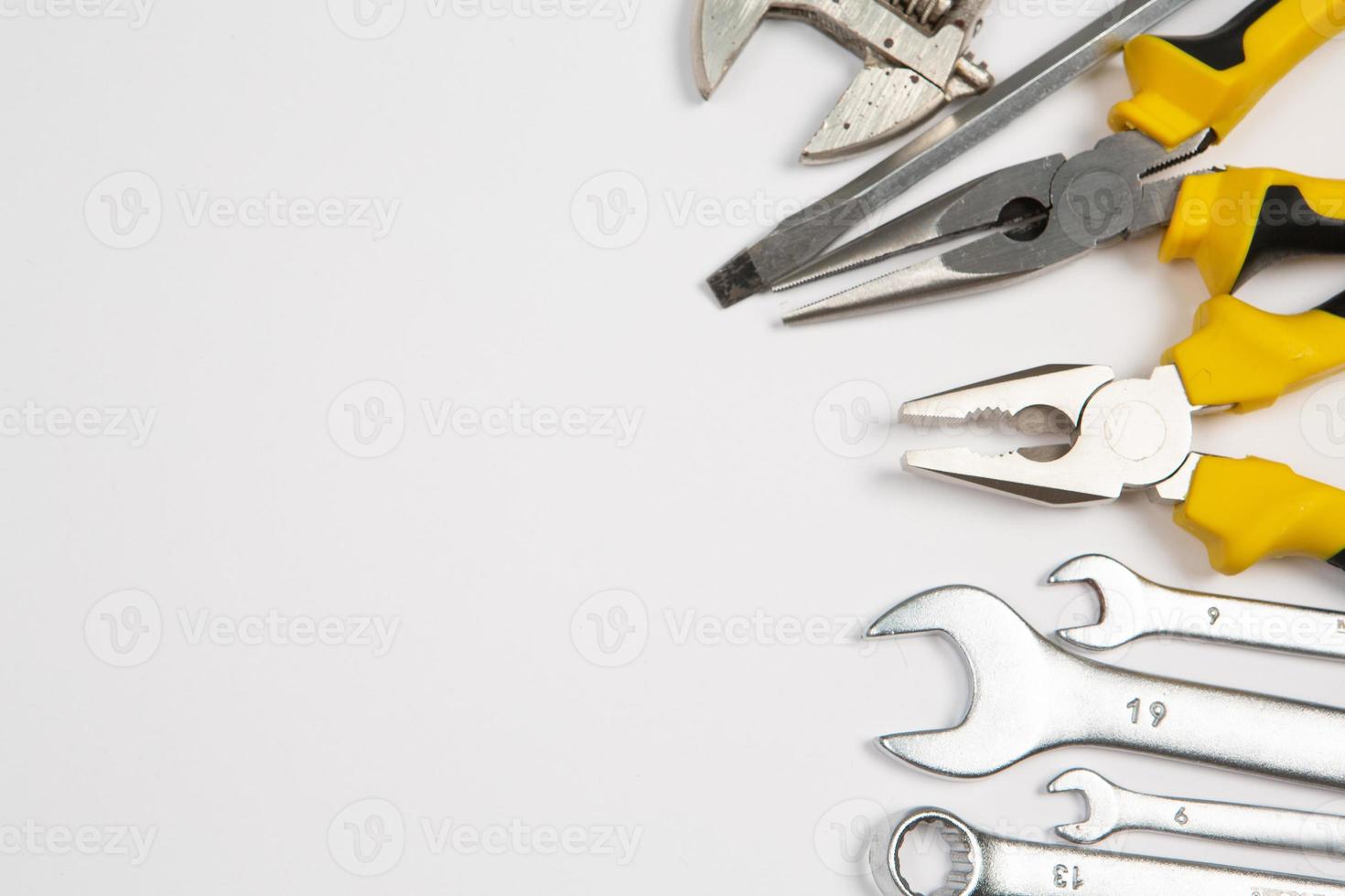 Set of tools for repair in a case on a white background. Assorted work or construction tools. Wrenches, Pliers, screwdriver. Top view photo