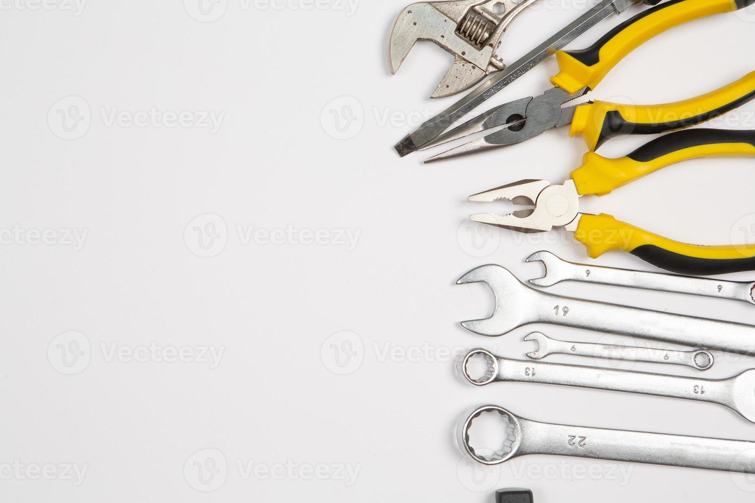 Set of tools for repair in a case on a white background. Assorted work or construction tools. Wrenches, Pliers, screwdriver. Top view photo