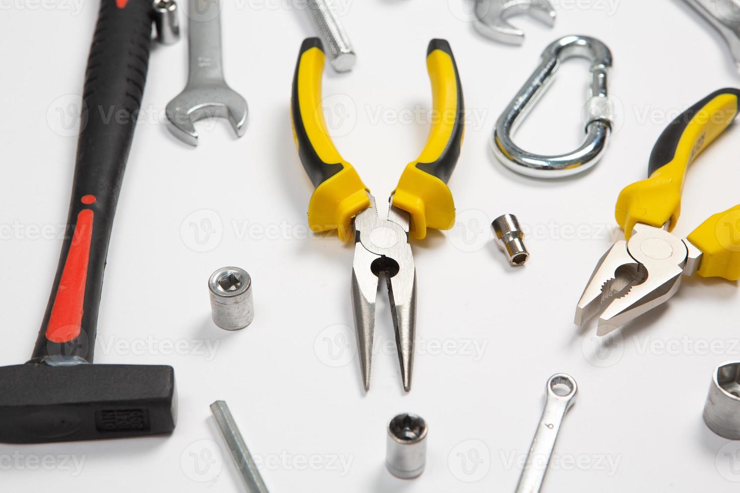 Set of tools for repair in a case on a white background. Assorted work or construction tools. Wrenches, Pliers, screwdriver. Top view photo