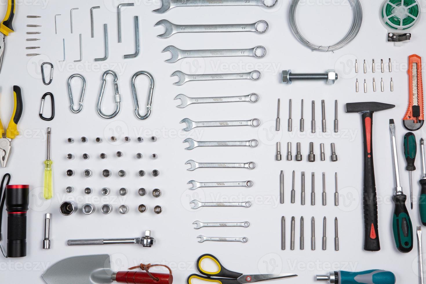 Set of tools for repair in a case on a white background. Assorted work or construction tools. Wrenches, Pliers, screwdriver. Top view photo