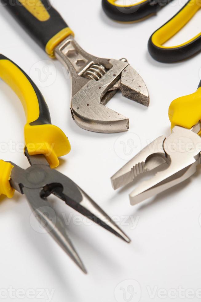 Set of tools for repair in a case on a white background. Assorted work or construction tools. Wrenches, Pliers, screwdriver. Top view photo