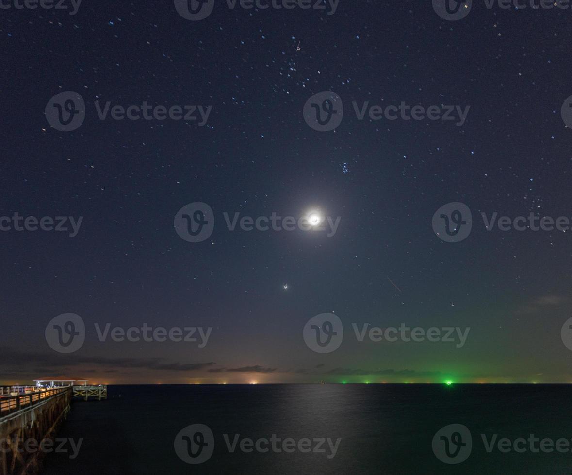 Night shot from Natai beach in Thailand with long exposure photo