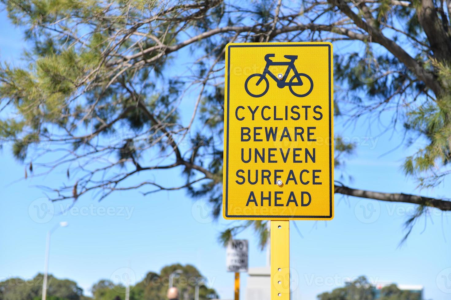 Warning sign for cyclist beware uneven surface ahead photo