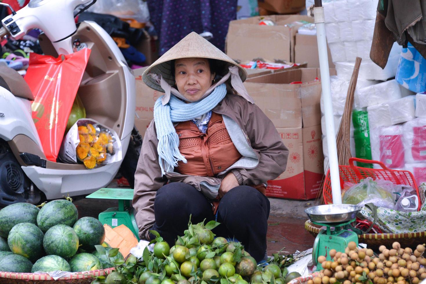 HOCHIMINH CITY - VIETNAM - DEC 12, 2016-Street vendor sale some fruits for Vietnamese in street market in Hue , Vietnam photo