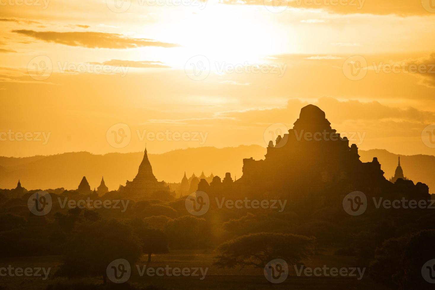 The sunset of Bagan, Myanmar is an ancient city with thousands of historic buddhist temples and stupas. photo