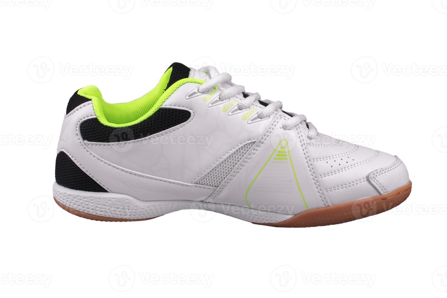 White sneaker with black inserts on a white background. photo