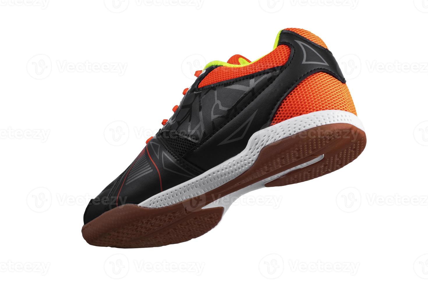 Black sneaker with orange laces and stripes. photo