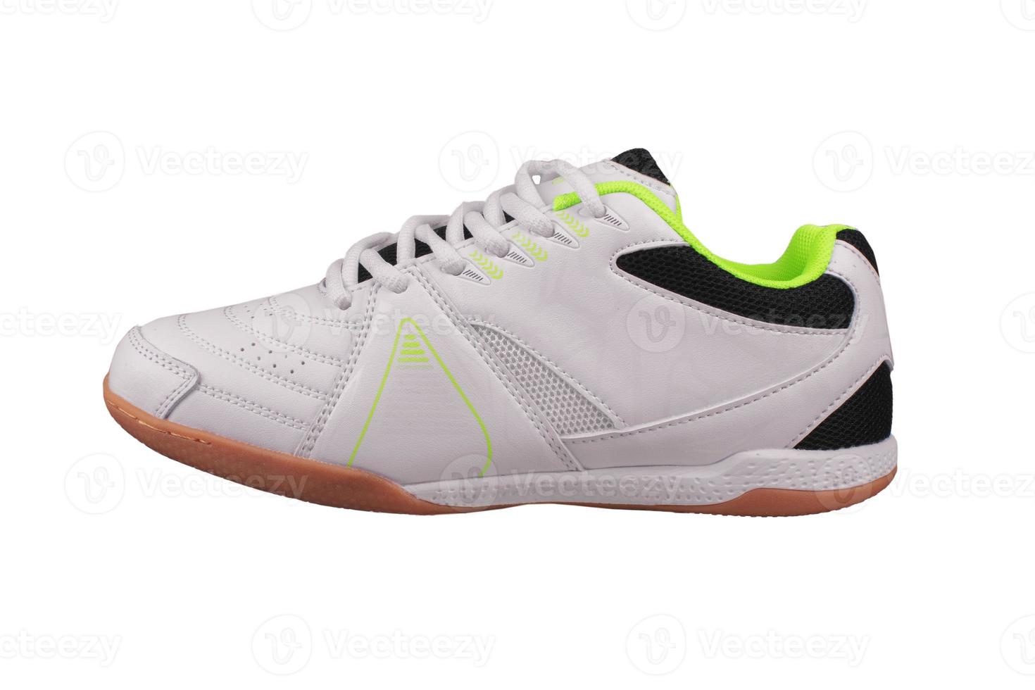 White sneaker with black inserts on a white background. photo