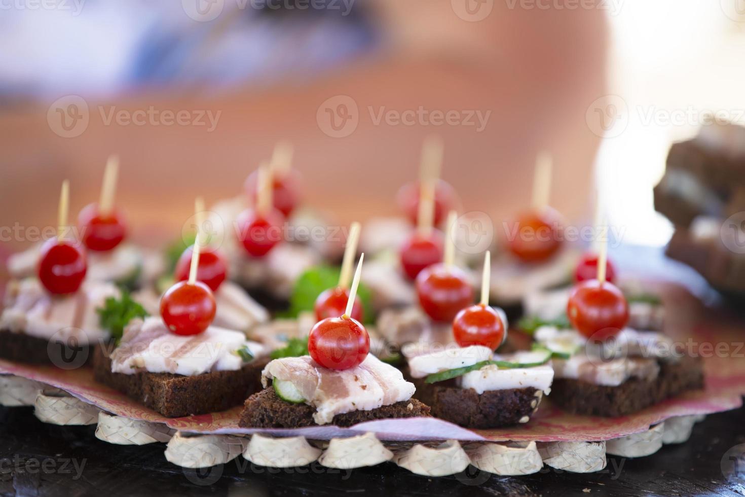 Sandwiches with bread and lard, garnished with cherry photo