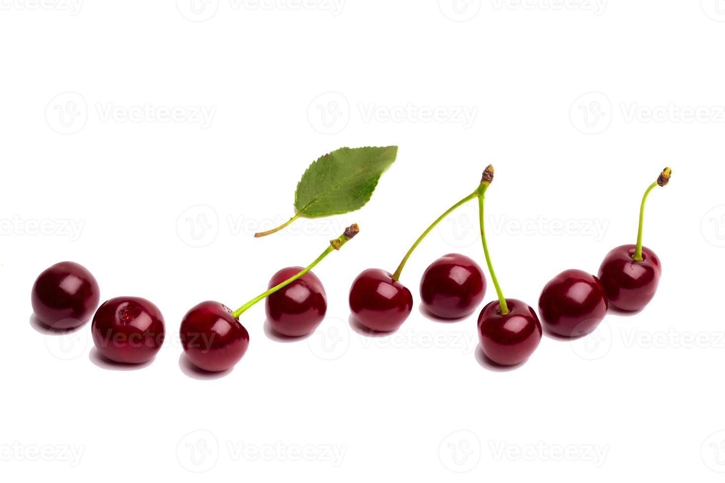Wishnf isolated on white background. Fresh cherries with green leaves. photo